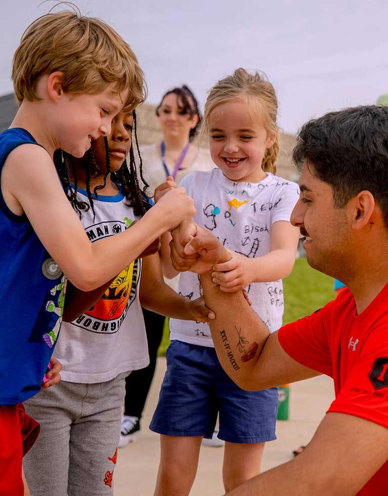 Charity worker with kids